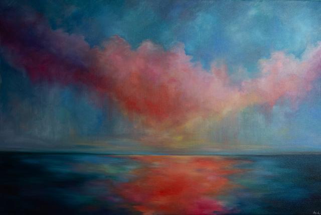 Pink and red sunset over calm water