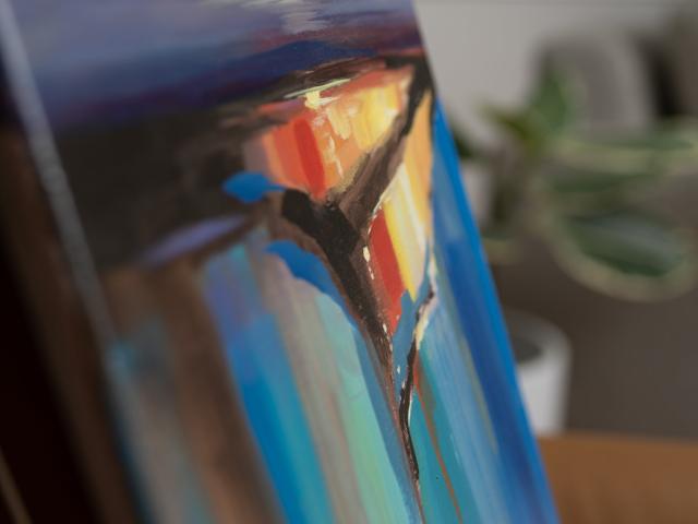 Framed painting in a studio setting