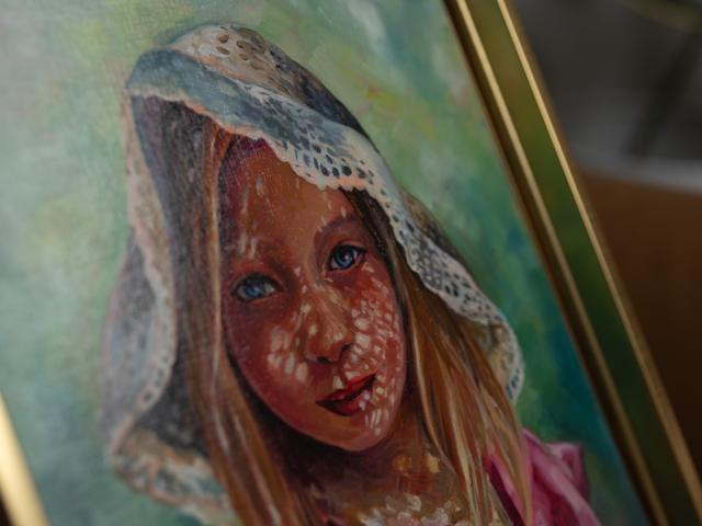 Portrait of a girl in a lace hood, alternate angle