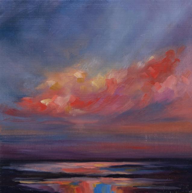 Red and pink sunset clouds over water