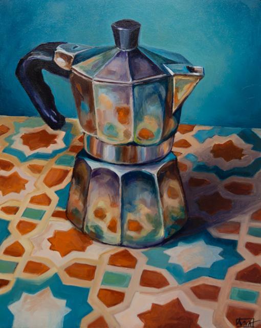 Still life of a moka pot on a tiled cloth
