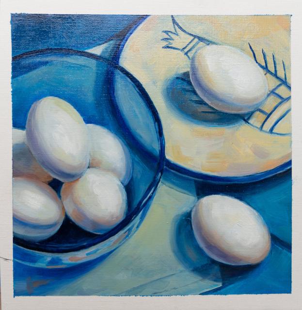 Still life of eggs on a blue plate
