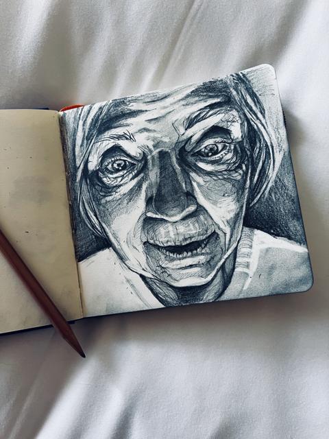Pencil sketch of an elderly woman, in the sketchbook