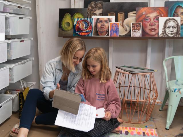 Color photo: reading together in the studio