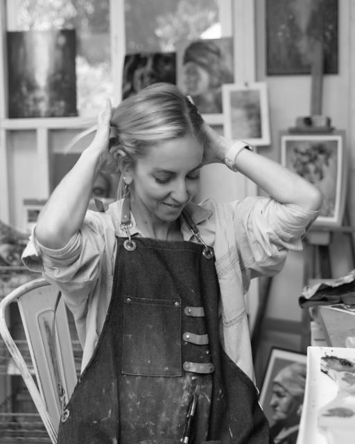 Black and white photo: a quiet pause at the easel