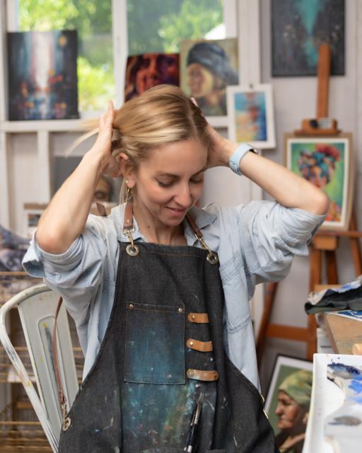 Color photo: a quiet pause at the easel