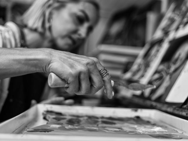 Black and white photo: working the palette with a knife