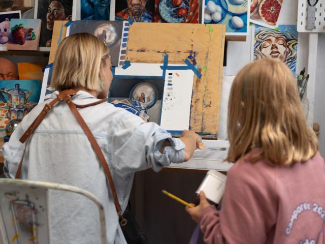 Color photo: painting together at the easel