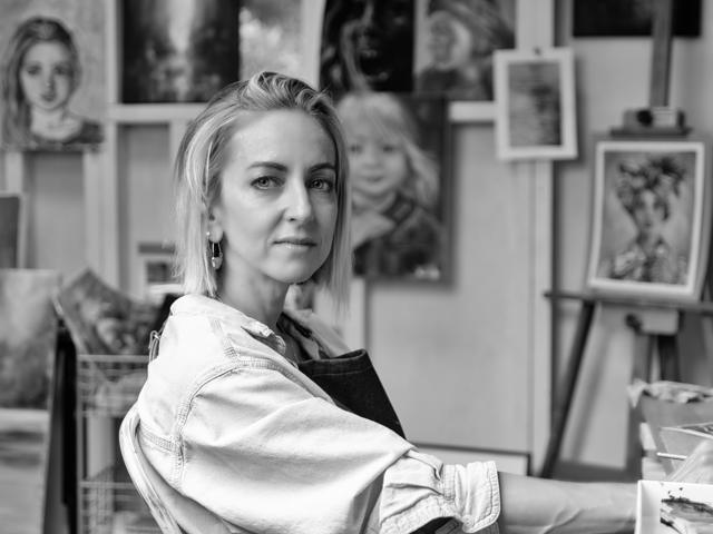 Black and white photo: looking up from the easel